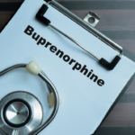 A clipboard with a paper that reads 'Buprenorphine' and a stethoscope resting on it.